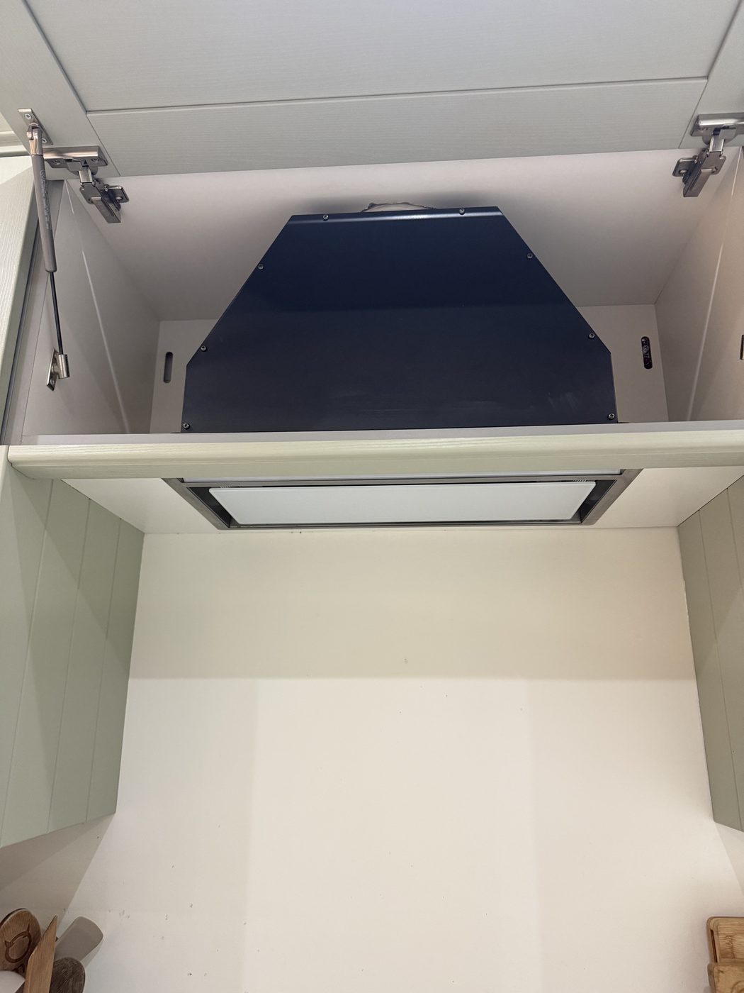 A cooker hood cabinet made good during a kitchen refit