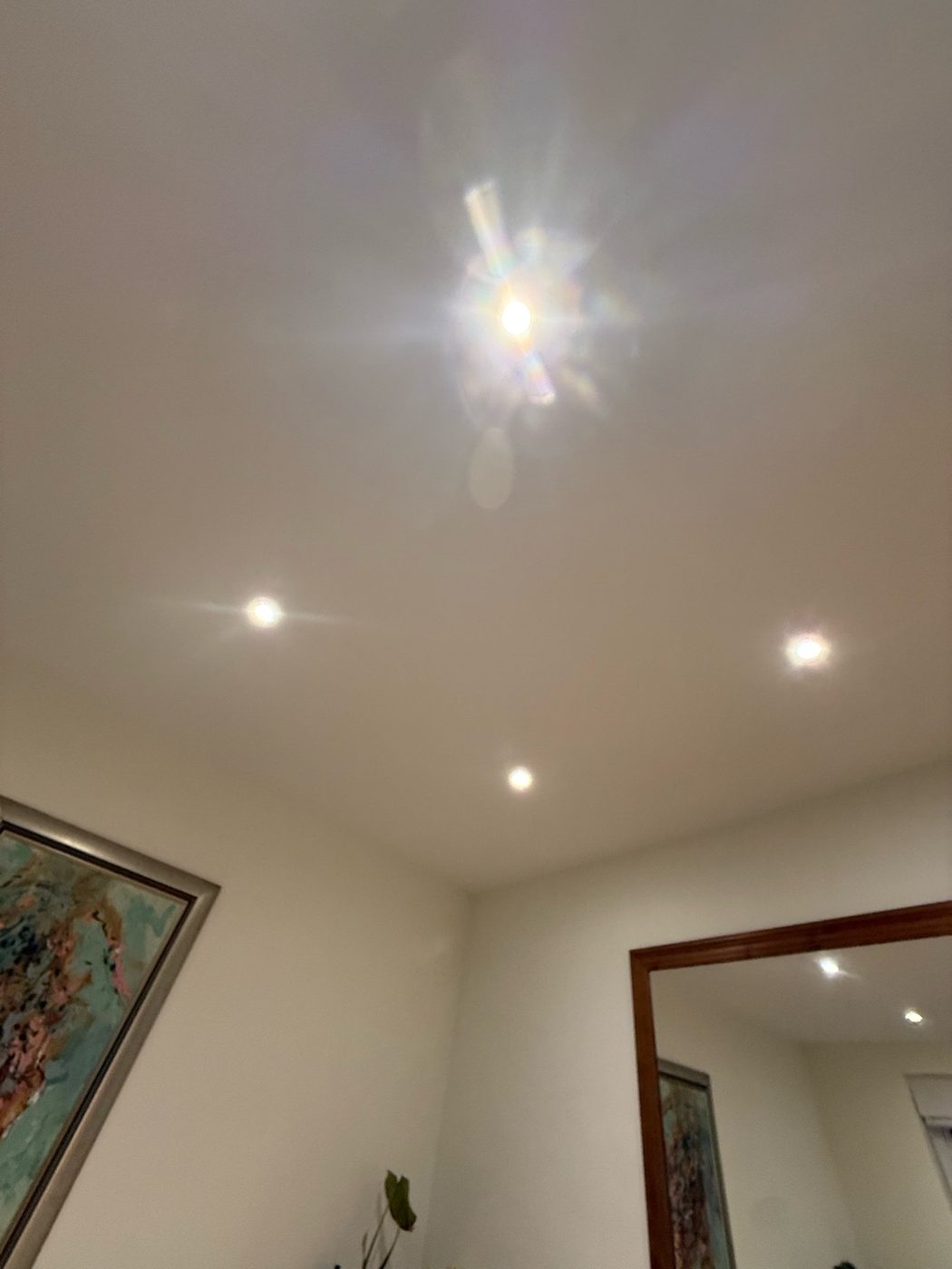 Square downlights fitted along a hallway