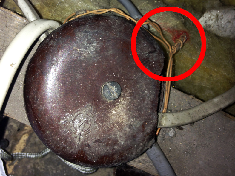 Earth conductors twisted together outside a damaged junction box