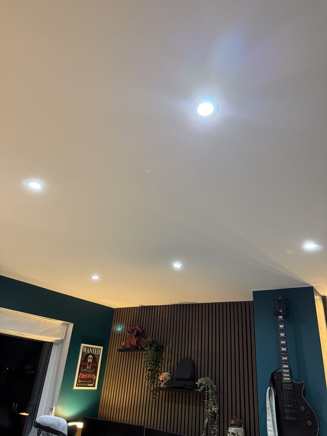 A lounge lit by new downlights on a dimmer