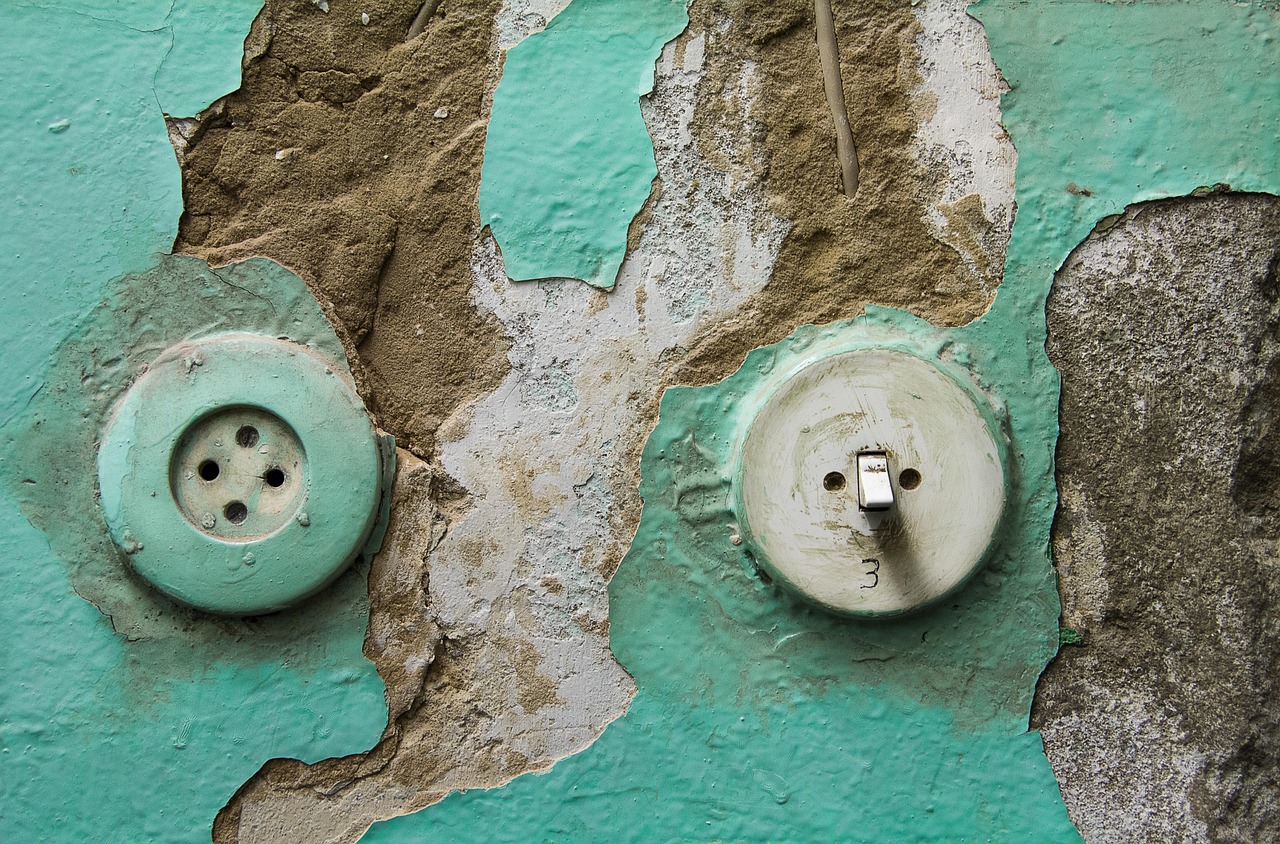 Old wall switches ready for replacement